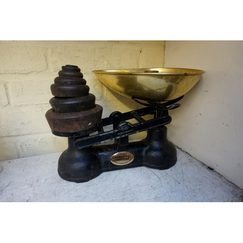 1223 - A set of Salter kitchen scales, with various weights.