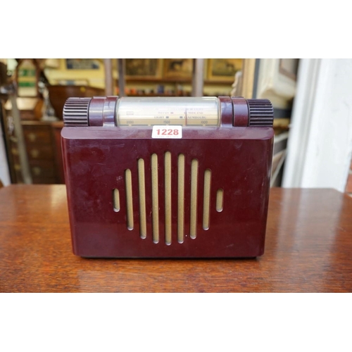 1228 - A vintage Murphy A100 maroon Bakelite radio, 23cm wide.