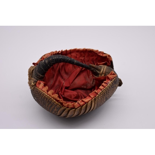 1253 - Taxidermy: a novelty armadillo basket, with red silk lining, 18.5cm wide.