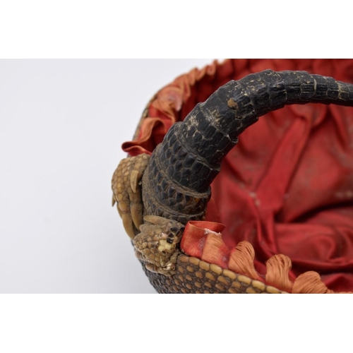 1253 - Taxidermy: a novelty armadillo basket, with red silk lining, 18.5cm wide.