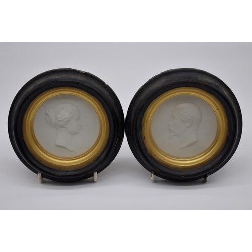 1254 - A pair of 19th century Sevres bisque circular relief plaques of Napoleon III and Eugénie, each insc... 