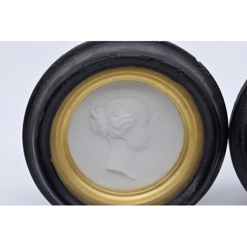 1254 - A pair of 19th century Sevres bisque circular relief plaques of Napoleon III and Eugénie, each insc... 