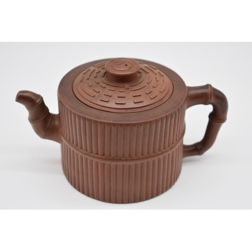 1256 - A Chinese yixing teapot and cover, seal mark to base and interior of lid, moulded with bamboo decora... 