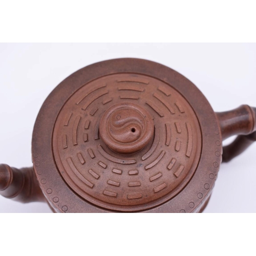 1256 - A Chinese yixing teapot and cover, seal mark to base and interior of lid, moulded with bamboo decora... 