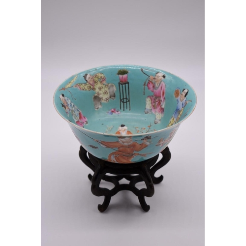 1258 - A Chinese turquoise ground famille rose 'boys' bowl, Qianlong seal mark, 20.5cm diameter, on associa... 