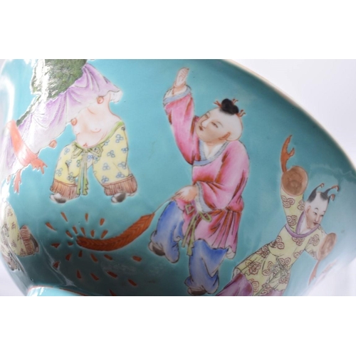 1258 - A Chinese turquoise ground famille rose 'boys' bowl, Qianlong seal mark, 20.5cm diameter, on associa... 