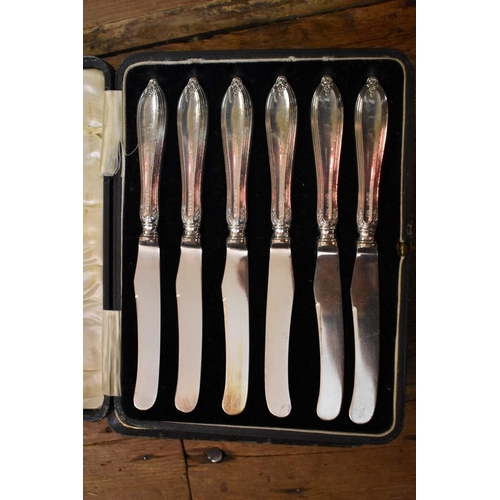 1262 - Two cased sets of six silver handled tea knives; together with a small quantity of silver plate.... 