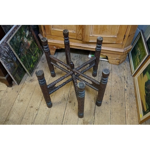 1303 - An Eastern brass top folding occasional table, 79cm diameter. 