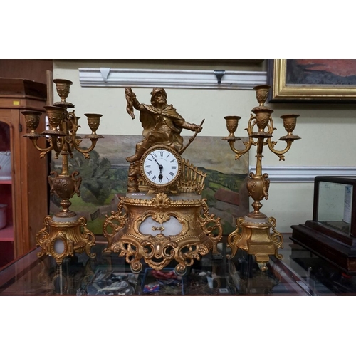 1304 - A gilt spelter and onyx clock garniture, 40cm high, (s.d.), no pendulum.