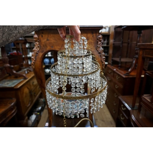 1311 - A brass and faceted bead four tier chandelier, 24.5cm diameter, (s.d.).