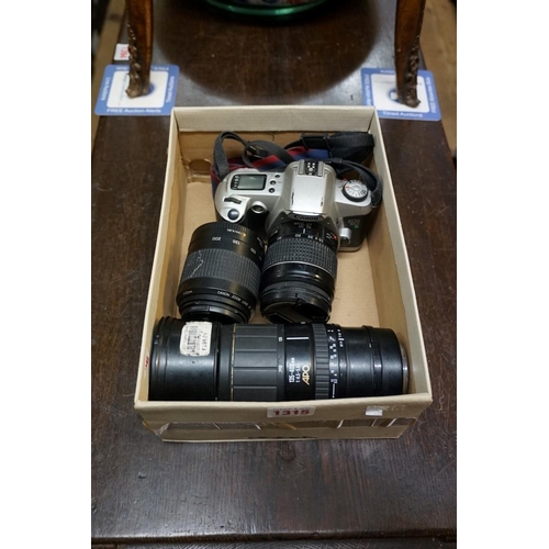 1315 - A Canon EOS 500N camera, with two Canon lenses; and a Sigma 135-400mm lens.