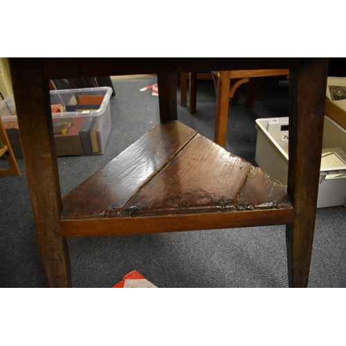 1456 - An antique oak cricket table, 72.5cm diameter.