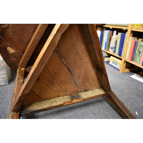 1456 - An antique oak cricket table, 72.5cm diameter.