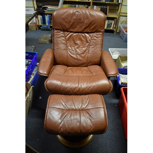 1460 - An Ekornes 'Stressless' brown leather chair and matching footstool.