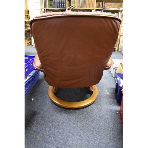 1460 - An Ekornes 'Stressless' brown leather chair and matching footstool.