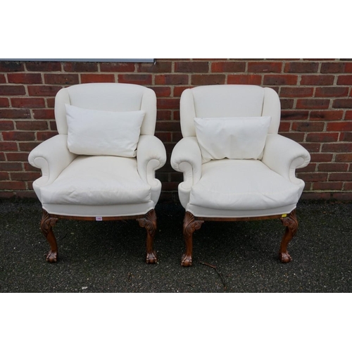 1462 - A pair of 1930s carved walnut armchairs, in the 18th century style, on cabriole legs with ball and c... 