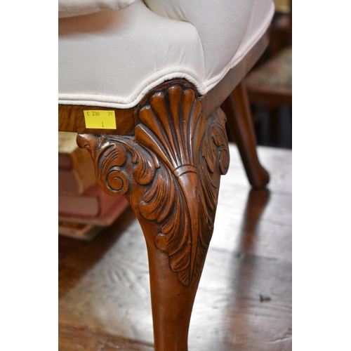 1462 - A pair of 1930s carved walnut armchairs, in the 18th century style, on cabriole legs with ball and c... 