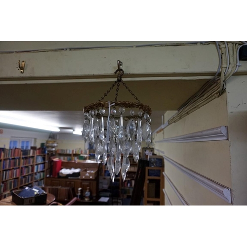 1471 - An old brass and faceted glass drop three tier chandelier, 22cm diameter.