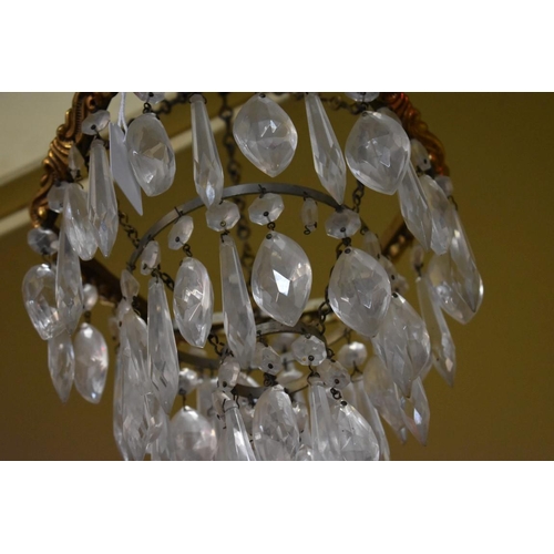 1471 - An old brass and faceted glass drop three tier chandelier, 22cm diameter.