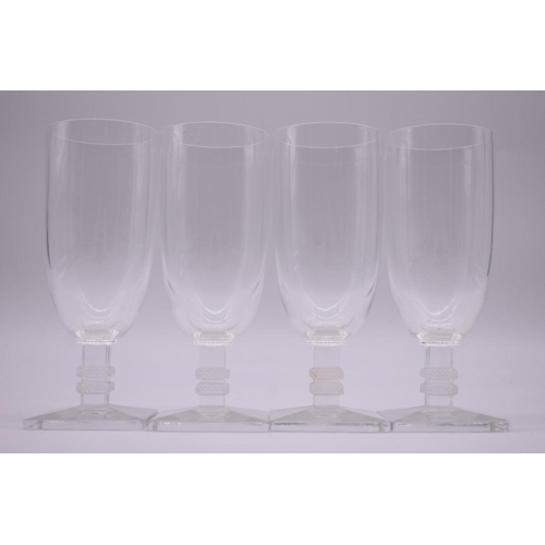 1475 - A set of four Lalique 'Argos' pattern champagne flutes, 15cm high.