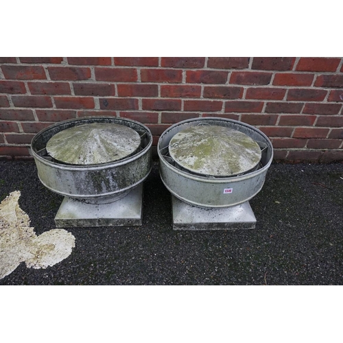 1546 - A pair of galvanized chimney cowls, labelled 'Greenwood Airvac', 48.5cm diameter.