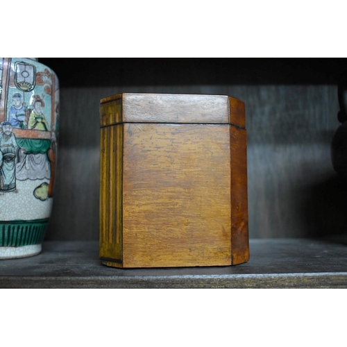 1550 - A George III satinwood and inlaid tea caddy, 19cm wide.