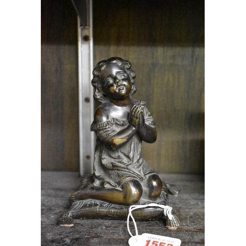 1553 - A Victorian bronze figure of a praying child, kneeling on a cushion, 15cm high.... 