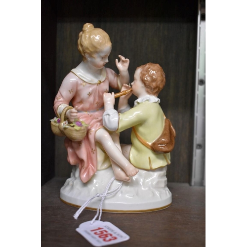 1563 - A KPM porcelain figure group of two children, 16.5cm high.