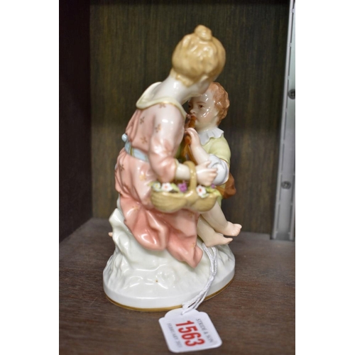 1563 - A KPM porcelain figure group of two children, 16.5cm high.