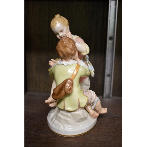 1563 - A KPM porcelain figure group of two children, 16.5cm high.