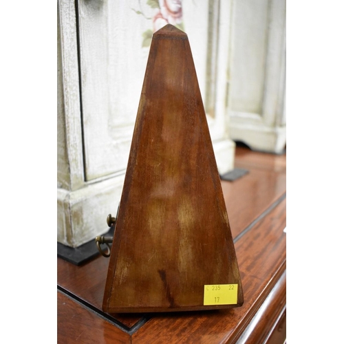 1569 - A Maelzel walnut cased metronome, No. 687450, 22cm high.