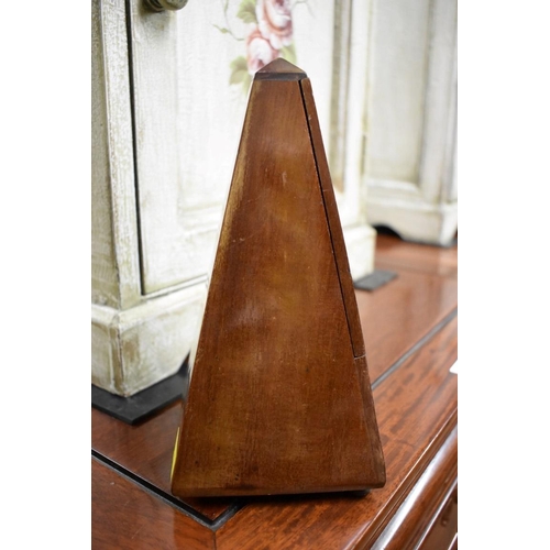 1569 - A Maelzel walnut cased metronome, No. 687450, 22cm high.