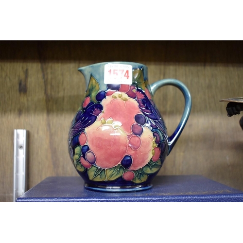 1574 - A Moorcroft 'Finches' pattern jug, 14cm high, boxed. 