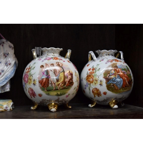 1599 - A collection of Continental porcelain, to include centrepieces and figures. (two shelves)... 