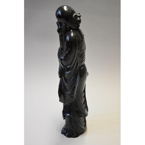 1604 - A Chinese hardstone figure of an immortal, 36.5cm high. 