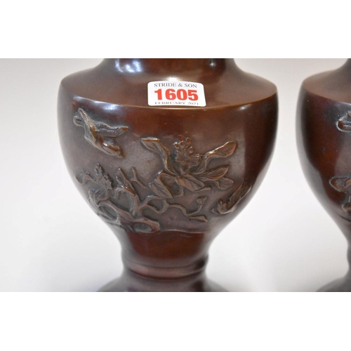 1605 - A pair of Japanese bronzed twin handled vases, 33cm high.