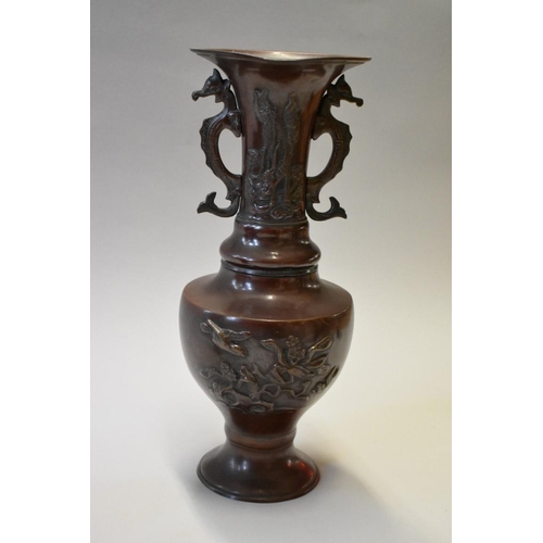 1605 - A pair of Japanese bronzed twin handled vases, 33cm high.