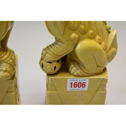 1606 - A pair of Chinese yellow glazed dogs of fo, 30cm high.