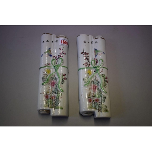 1609 - A pair of Chinese famille rose wall pockets, each in the form of a tied scroll, 23cm long.... 