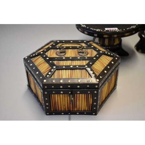 1612 - Three Ceylonese ebony and porcupine quill items, to include: a hexagonal casket, 21cm wide; together... 