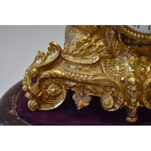 1614 - A late 19th century Continental gilt spelter mantel time piece, 26.5cm high, on wood stand, with ass... 