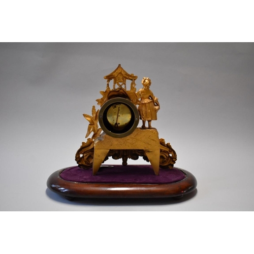 1614 - A late 19th century Continental gilt spelter mantel time piece, 26.5cm high, on wood stand, with ass... 