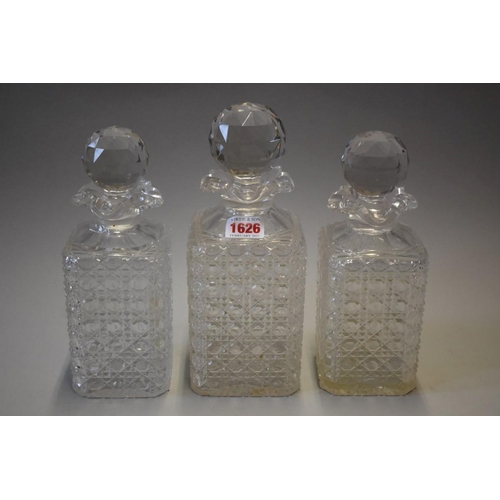 1626 - A set of three Victorian cut glass decanters, largest 25cm high, the base of each engraved 'Rd ... 