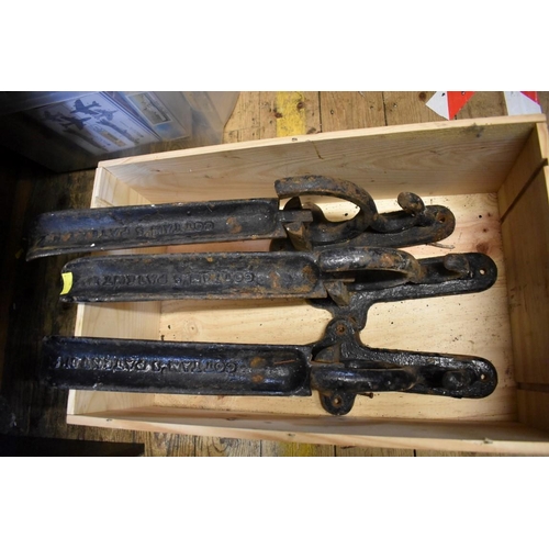 1631 - Three Victorian cast iron folding saddle hooks, each inscribed 'Cottan's Patent No.2'; together with... 