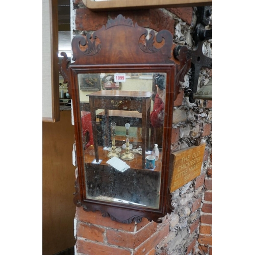 1099 - An antique mahogany fret framed wall mirror, 66 x 38cm; together with another 1930s walnut framed ex... 