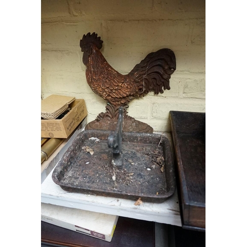 1234 - An old cast iron boot scraper, 27cm wide; and a cast iron cockerel doorstop, 31cm high. ... 