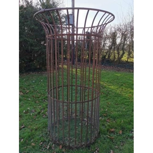 1538 - A large wrought iron tree guard, 217.5cm high x 128cm diameter.