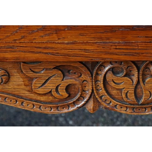 1187 - A good carved oak dining suite, comprising: a draw leaf table, 213cm extended; six dining chairs, to... 