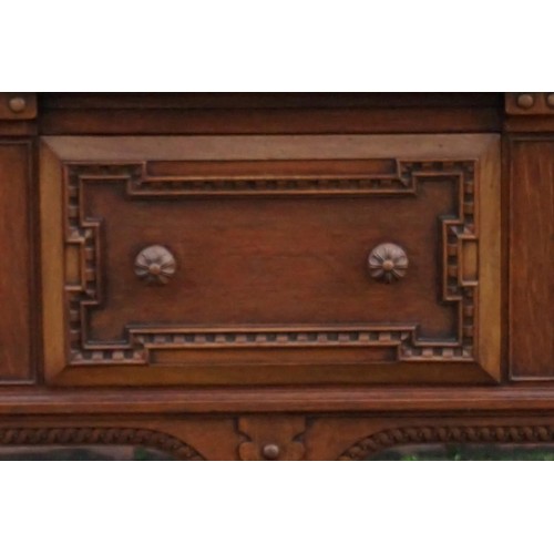 1187 - A good carved oak dining suite, comprising: a draw leaf table, 213cm extended; six dining chairs, to... 