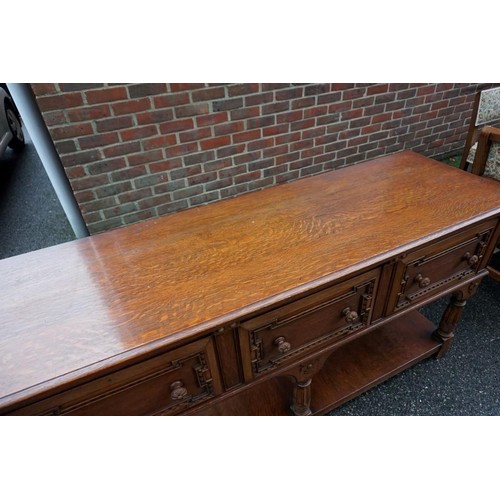 1187 - A good carved oak dining suite, comprising: a draw leaf table, 213cm extended; six dining chairs, to... 